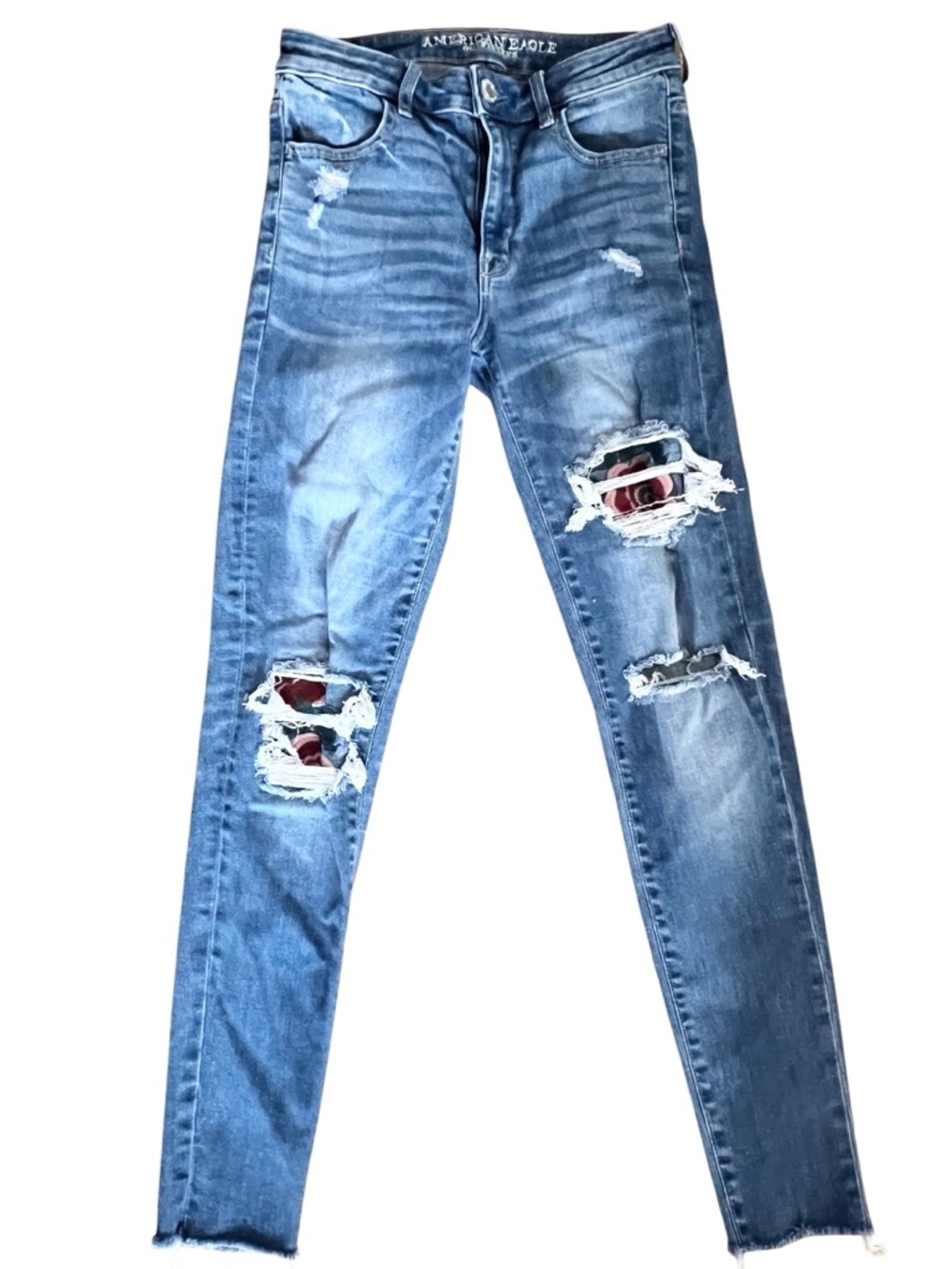 American Eagle Raw Hem Ripped Skinny Jeans with Floral Patch Details. Size 6